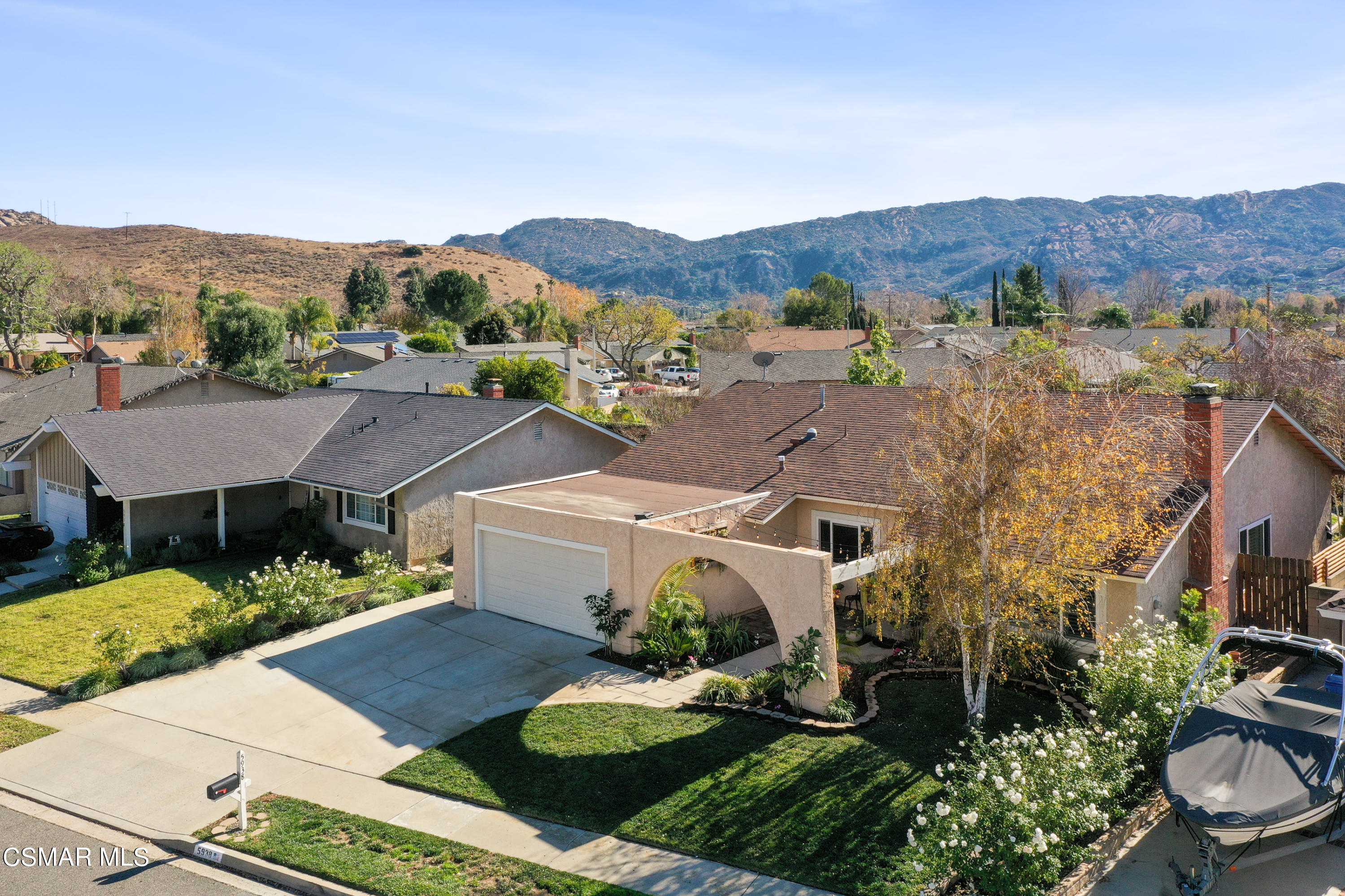 5938 Serena Street Simi Valley, CA 93063 - Photo 7 of 76 an aerial view of a house with a mountain in the background