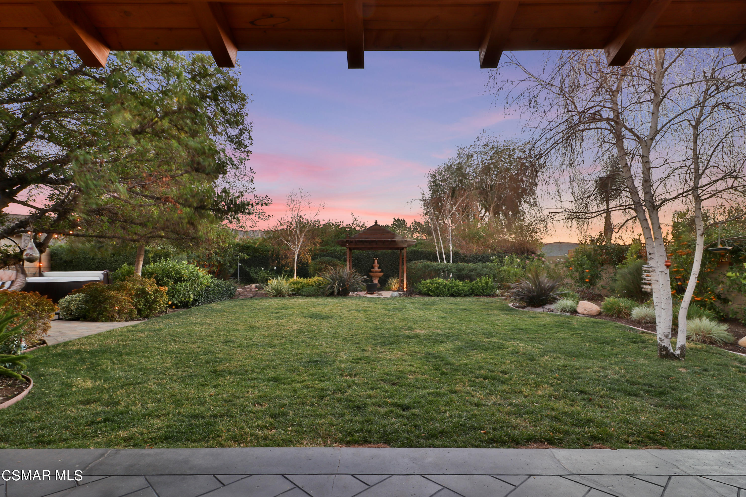 5938 Serena Street Simi Valley, CA 93063 - Photo 74 of 76 a backyard of a house with plants and large trees