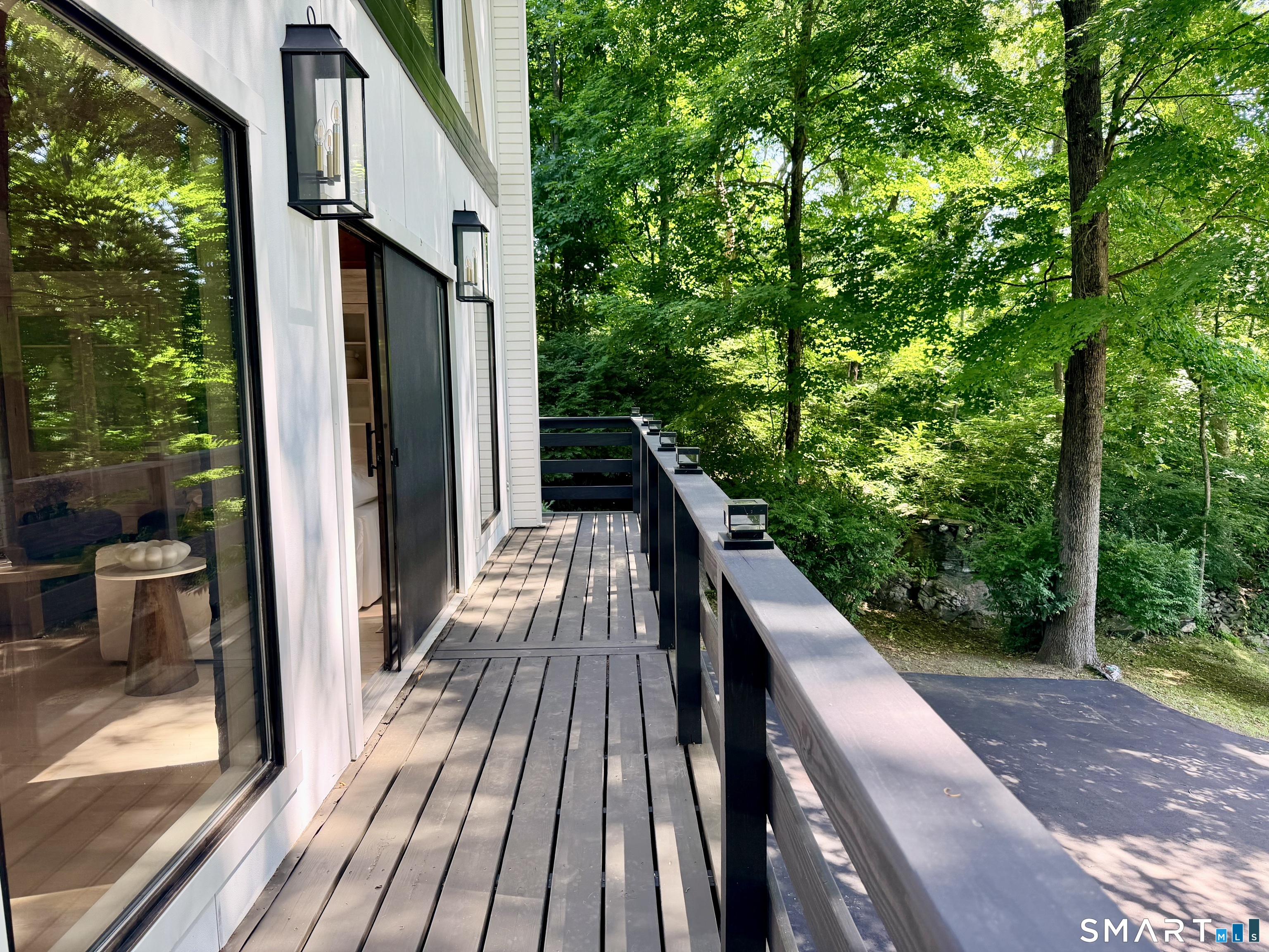 237 Strobel Road Trumbull, CT 06611 - Photo 17 of 35 Main level balcony deck directly off the living room sliders & extends the full length of the house.