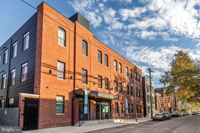 a front view of a building with a street