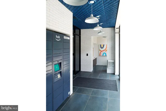 a view of a roof deck with chair and tables