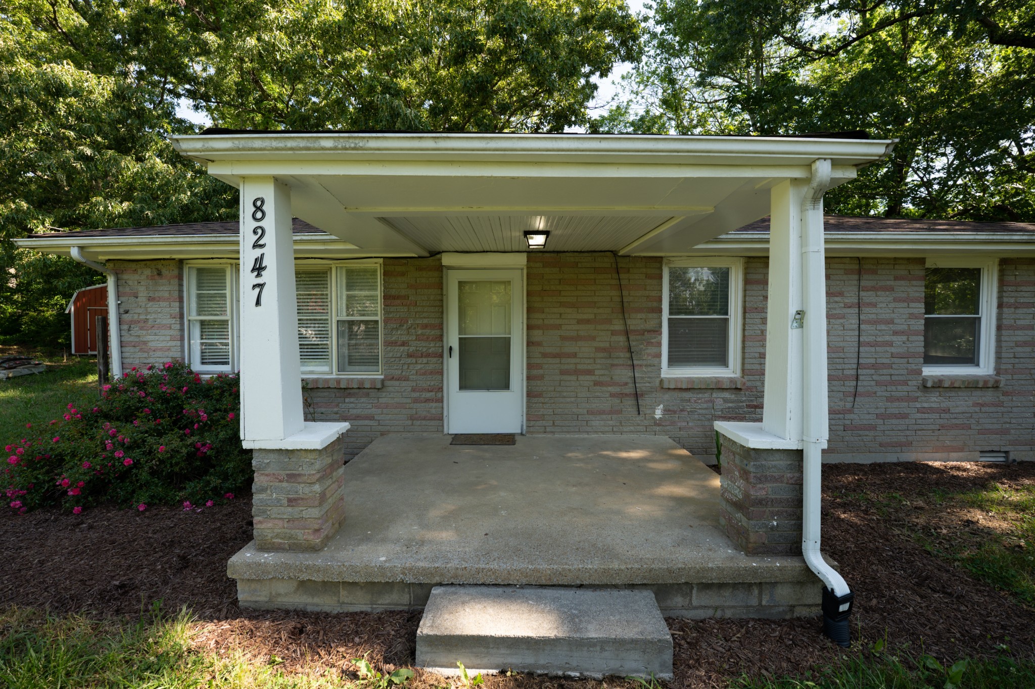 8247 Pinewood Road Nunnelly, TN 37137 - Photo 3 of 14 a view of a house with a porch