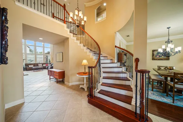 a kitchen with stainless steel appliances granite countertop a large counter top a stove and a sink