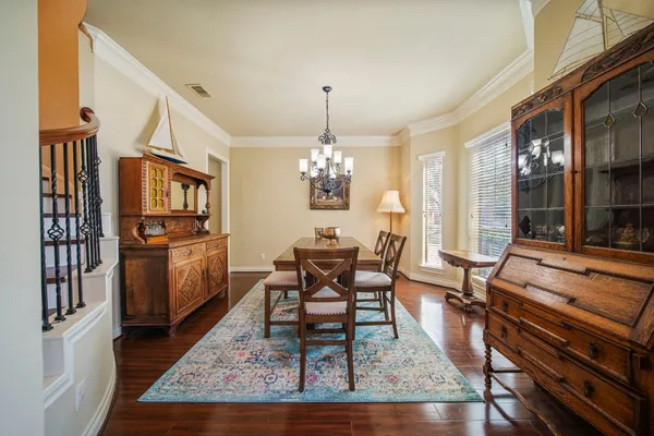 a bathroom with a granite countertop toilet sink and mirror