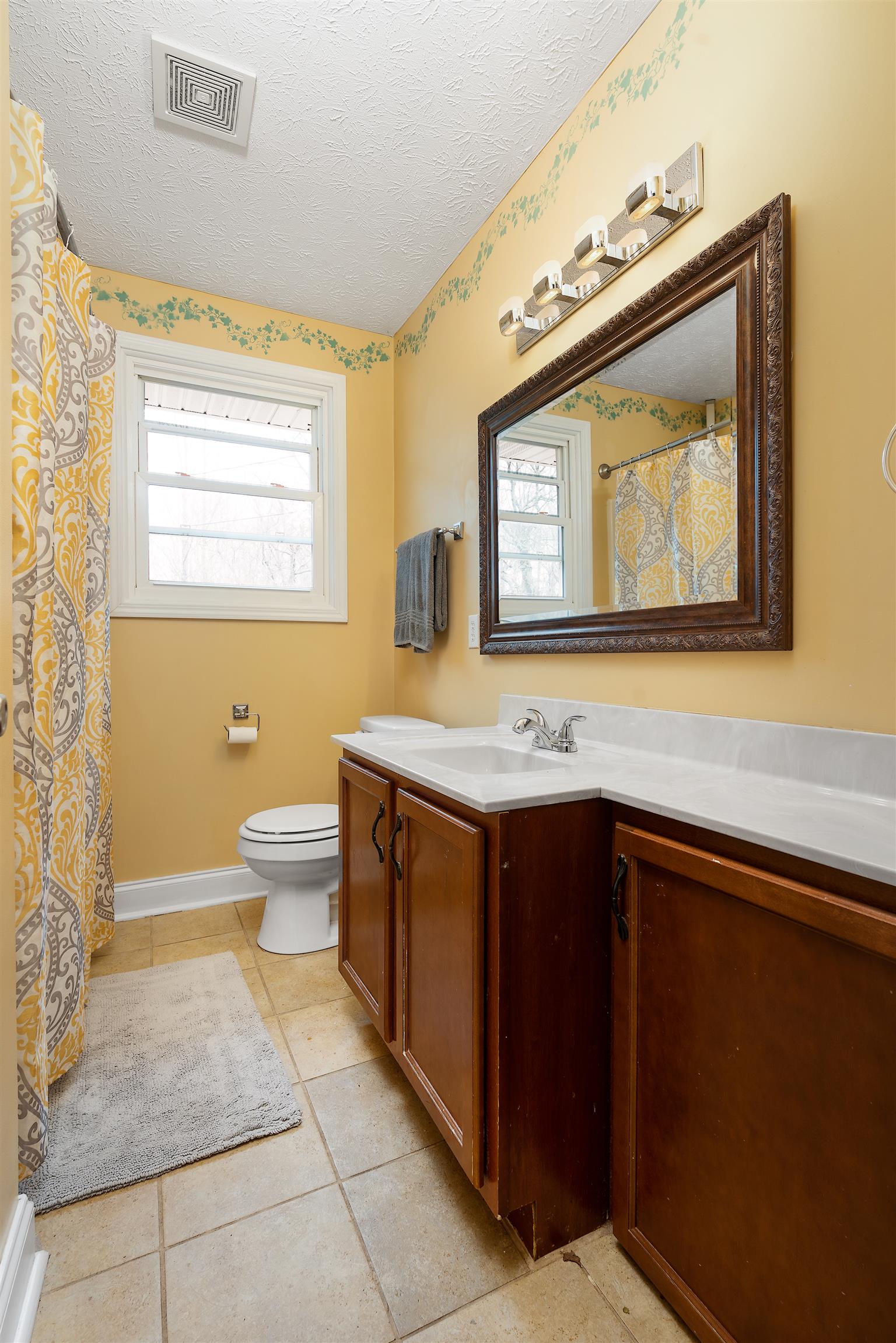 1578 Hickory Point Road Clarksville, TN 37043 - Photo 11 of 17 a bathroom with a sink and a mirror