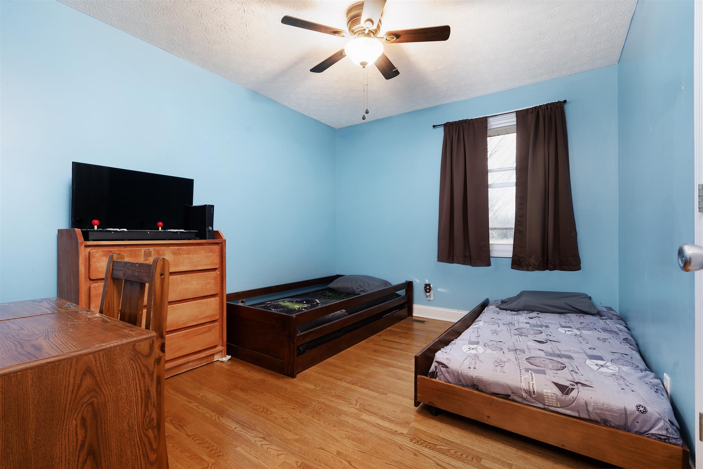 1578 Hickory Point Road Clarksville, TN 37043 - Photo 9 of 17 a bedroom with furniture and flat screen tv
