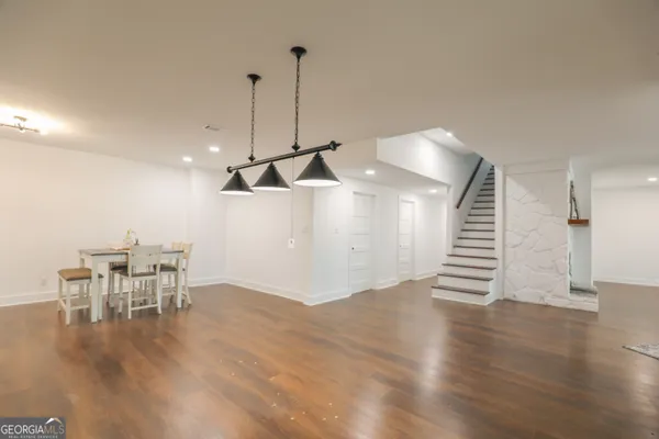 a view of a patio with table and chairs next to a yard