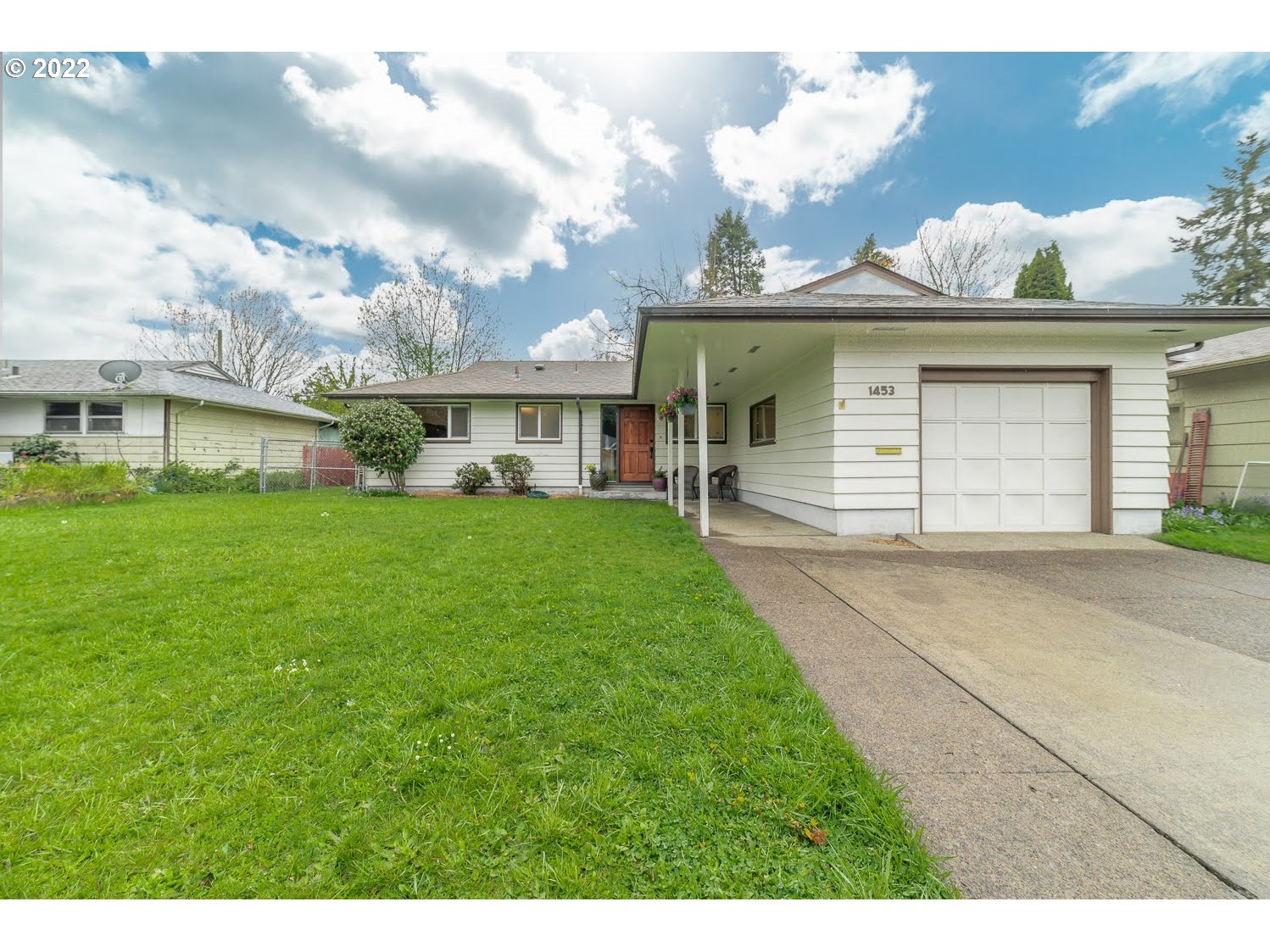 1453 Olympic Street Springfield, OR 97477 - Photo 1 of 31 a front view of a house with garden