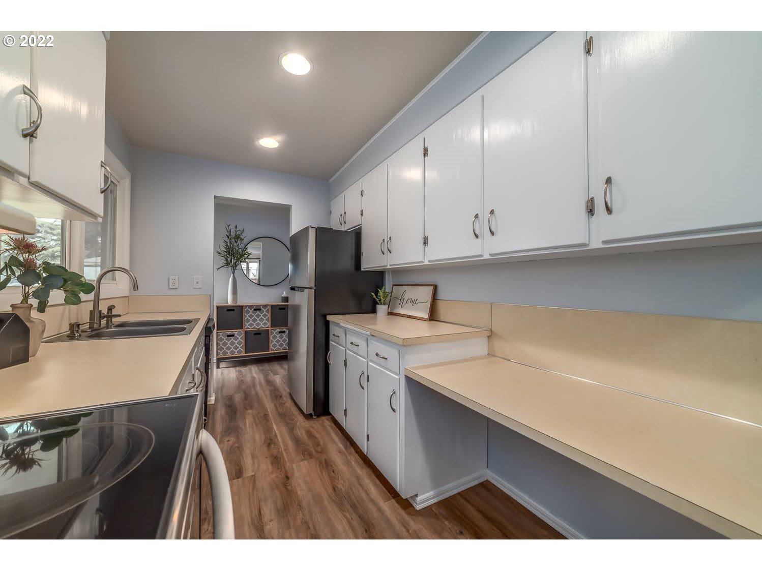 1453 Olympic Street Springfield, OR 97477 - Photo 14 of 31 a kitchen with a sink cabinets and wooden floor