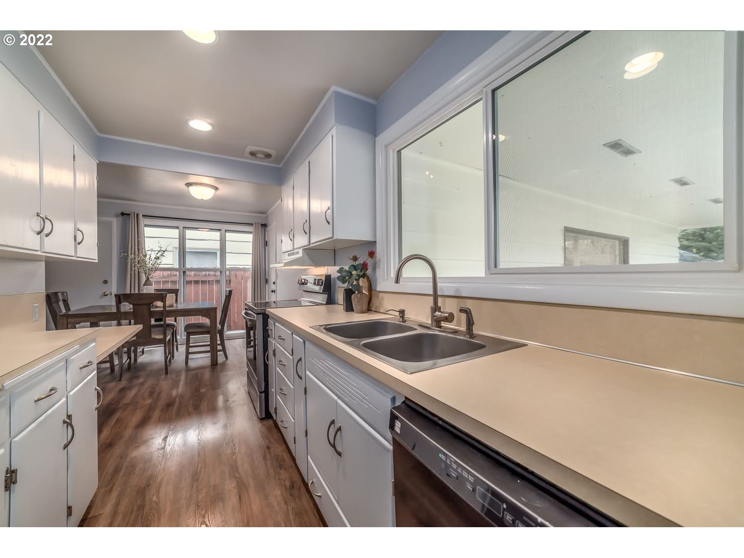 1453 Olympic Street Springfield, OR 97477 - Photo 15 of 31 a kitchen with sink stove and cabinets