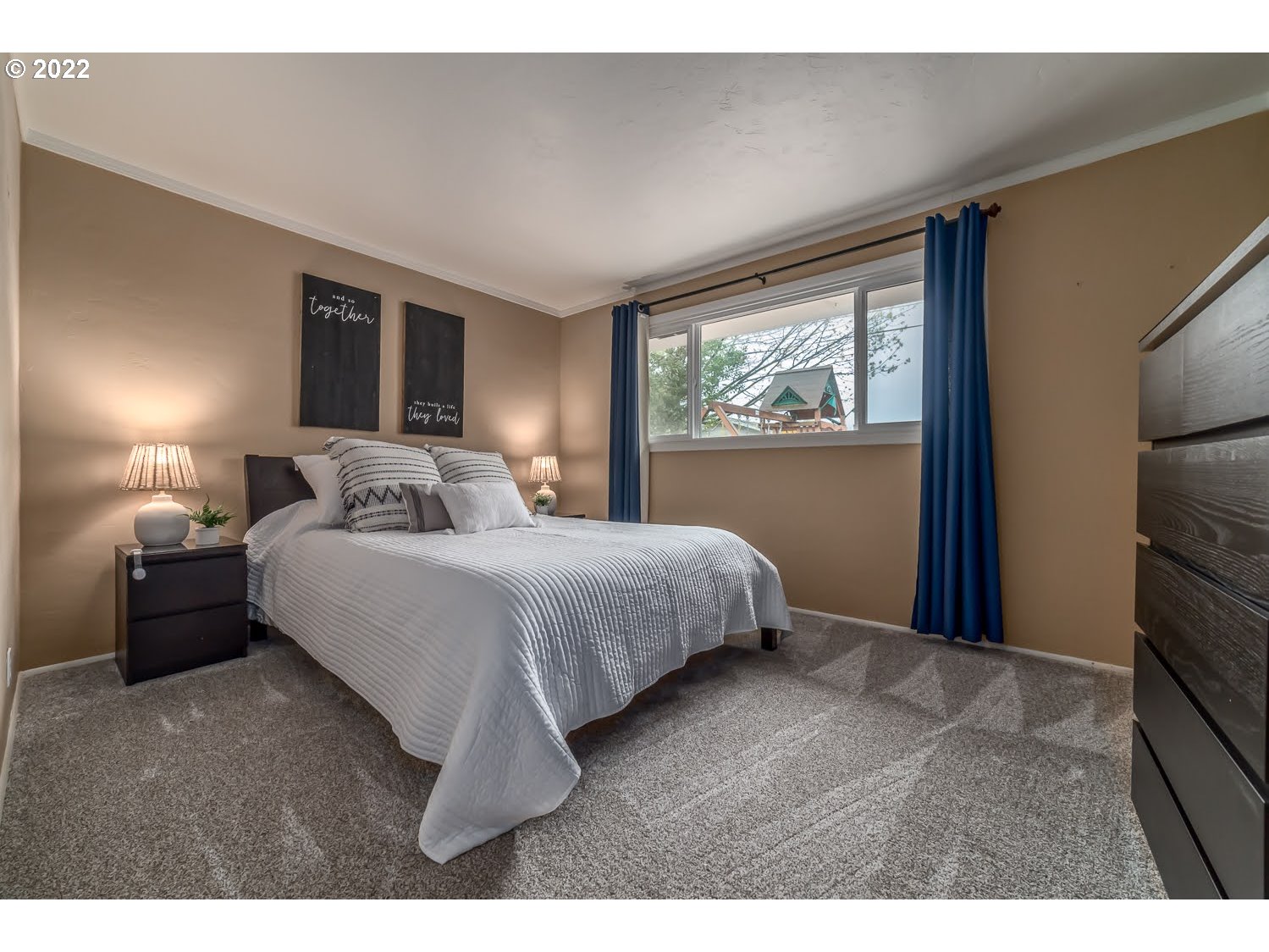 1453 Olympic Street Springfield, OR 97477 - Photo 17 of 31 a bedroom with a bed and a night stand