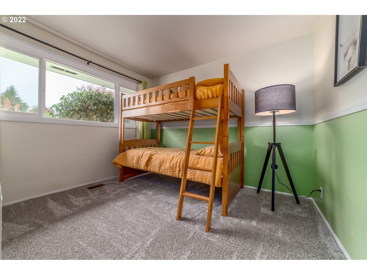 1453 Olympic Street Springfield, OR 97477 - Photo 19 of 31 a bedroom with a bed a lamp and a window