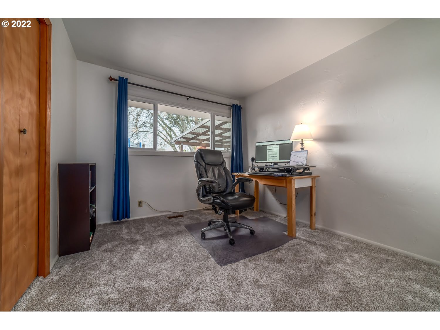 1453 Olympic Street Springfield, OR 97477 - Photo 23 of 31 a view of a workspace with furniture and a window