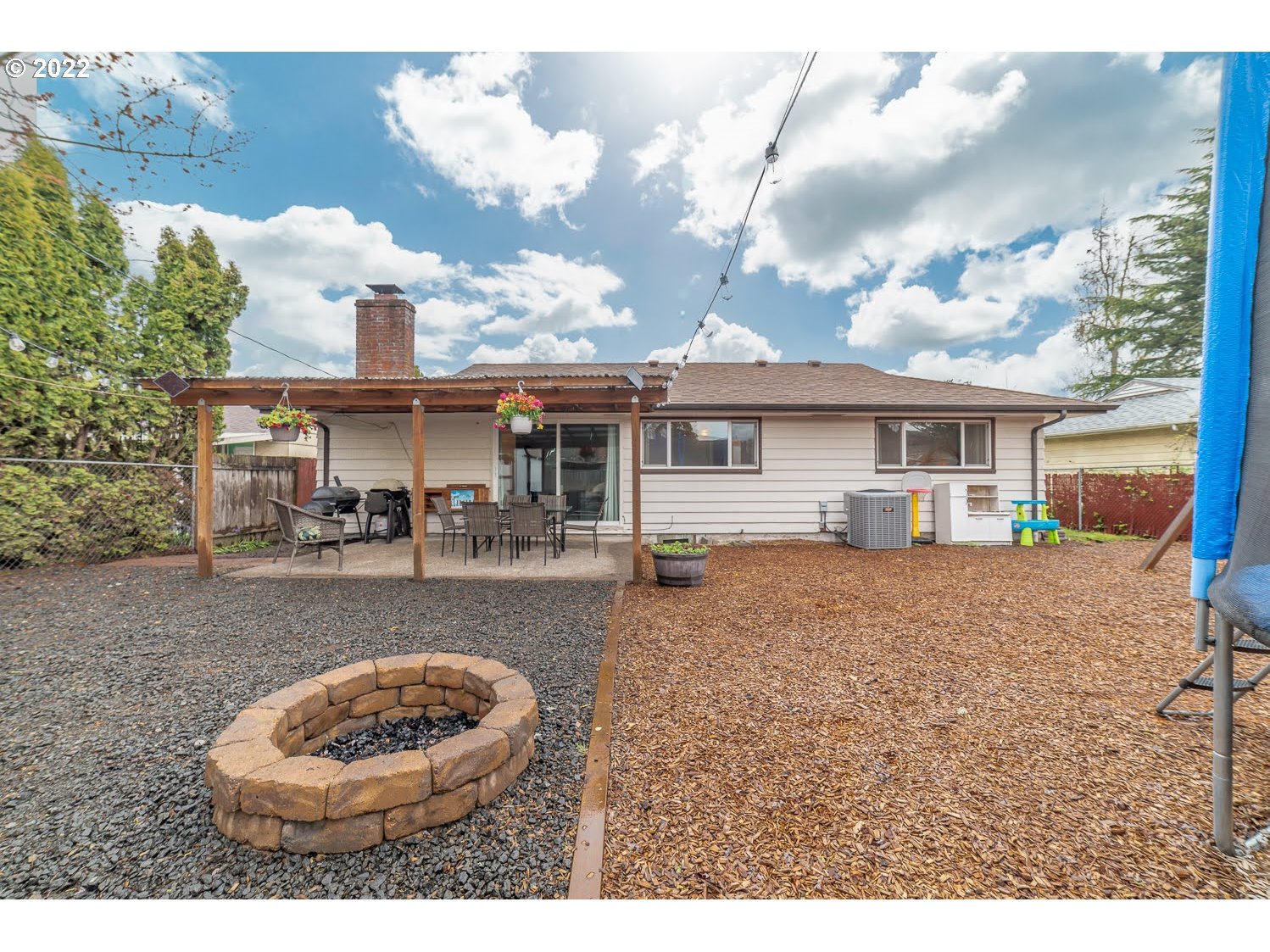 1453 Olympic Street Springfield, OR 97477 - Photo 24 of 31 a view of a house with backyard porch and sitting area