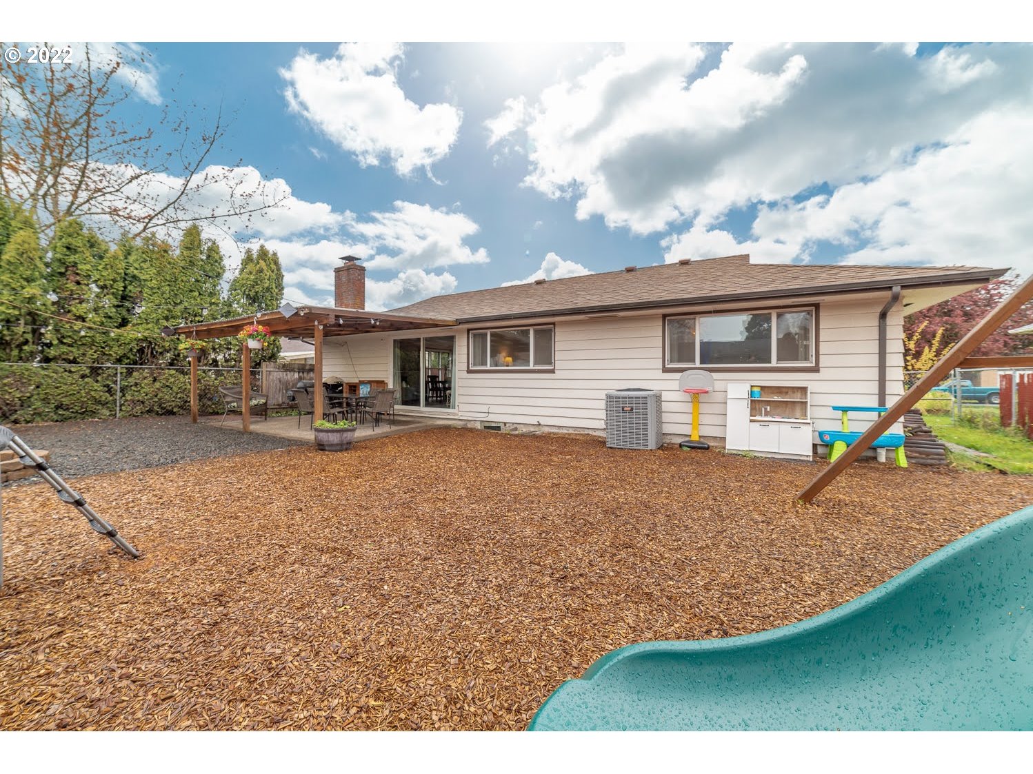 1453 Olympic Street Springfield, OR 97477 - Photo 31 of 31 a view of a house with backyard and sitting area