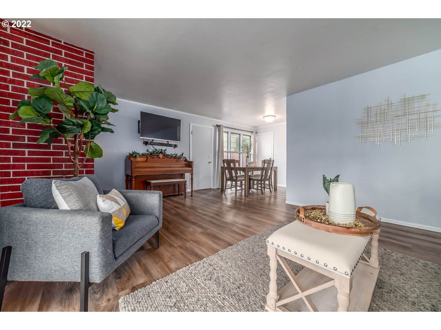 1453 Olympic Street Springfield, OR 97477 - Photo 10 of 31 a living room with furniture and a potted plant