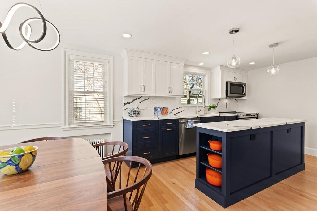 55 Harding Road Lexington, MA 02420 - Photo 3 of 18 a kitchen with stainless steel appliances granite countertop a stove a sink dishwasher and a microwave with wooden floor