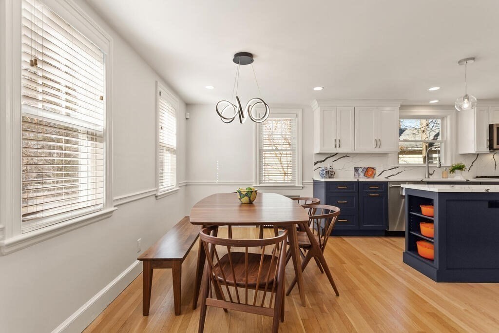 55 Harding Road Lexington, MA 02420 - Photo 5 of 18 a kitchen with a table chairs a sink dishwasher window and cabinets
