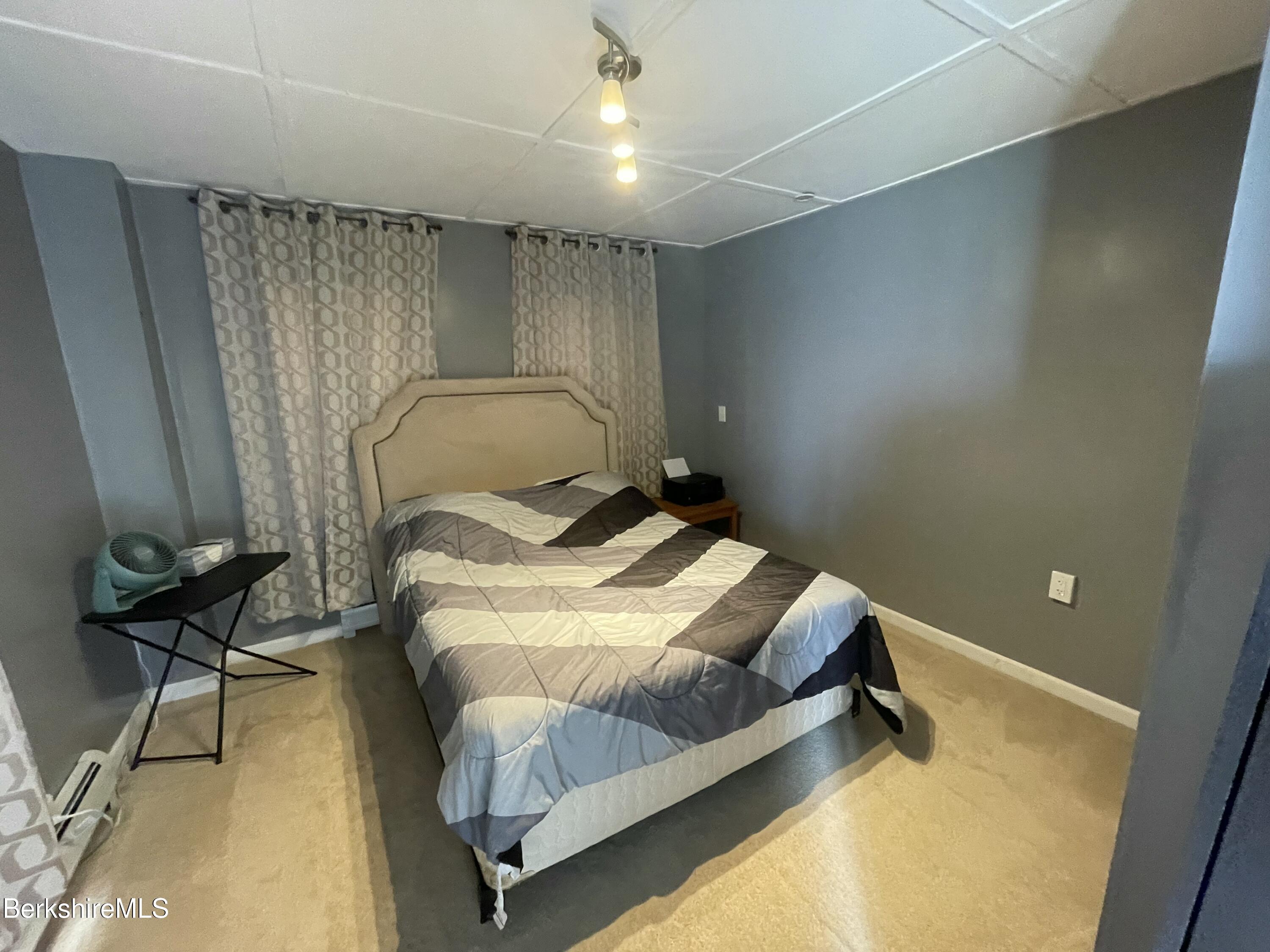 51 Foote Avenue Pittsfield, MA 01201 - Photo 11 of 16 a bedroom with a bed and furniture