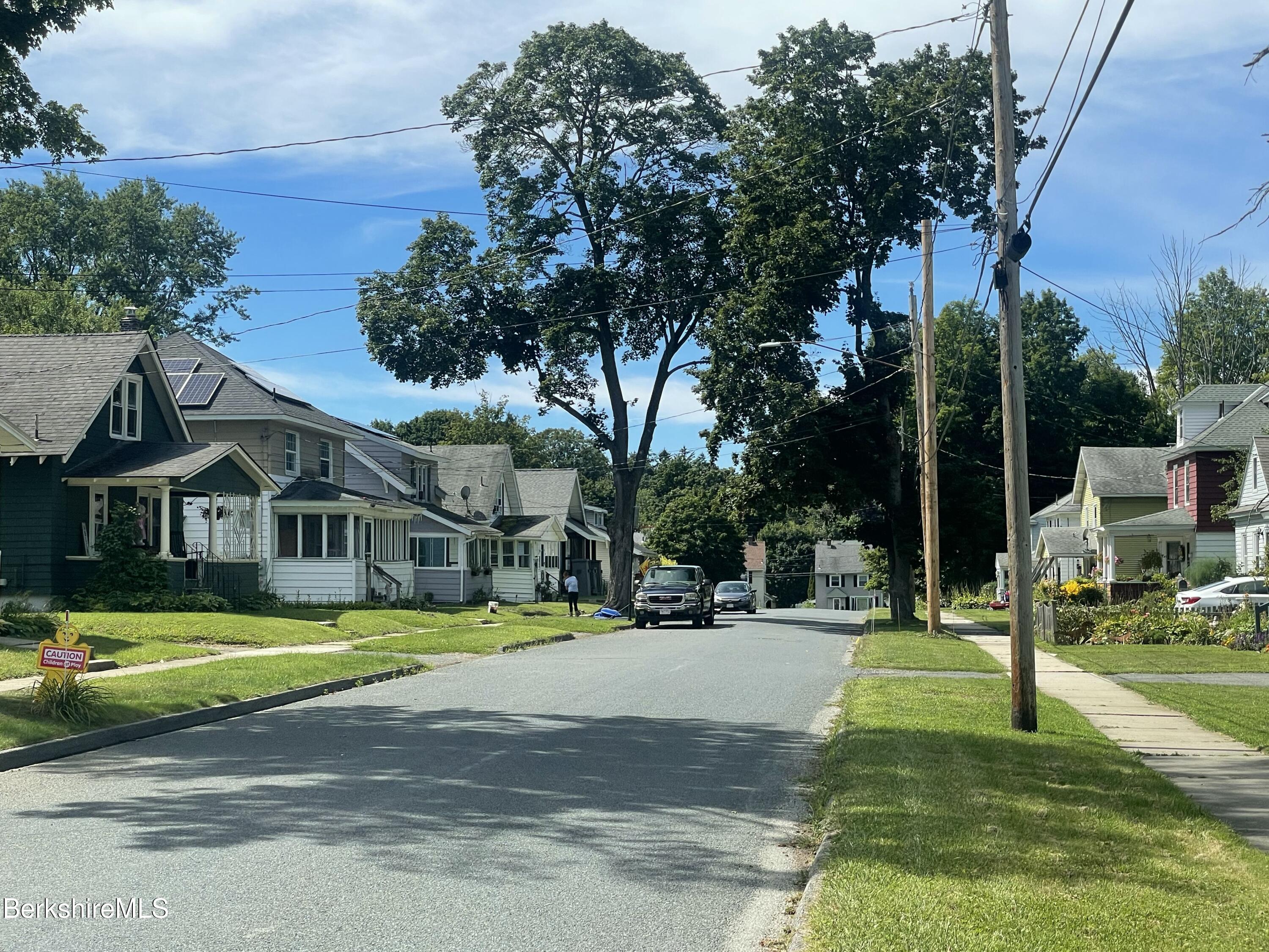 51 Foote Avenue Pittsfield, MA 01201 - Photo 7 of 16 a view of a white house with a big yard and large trees