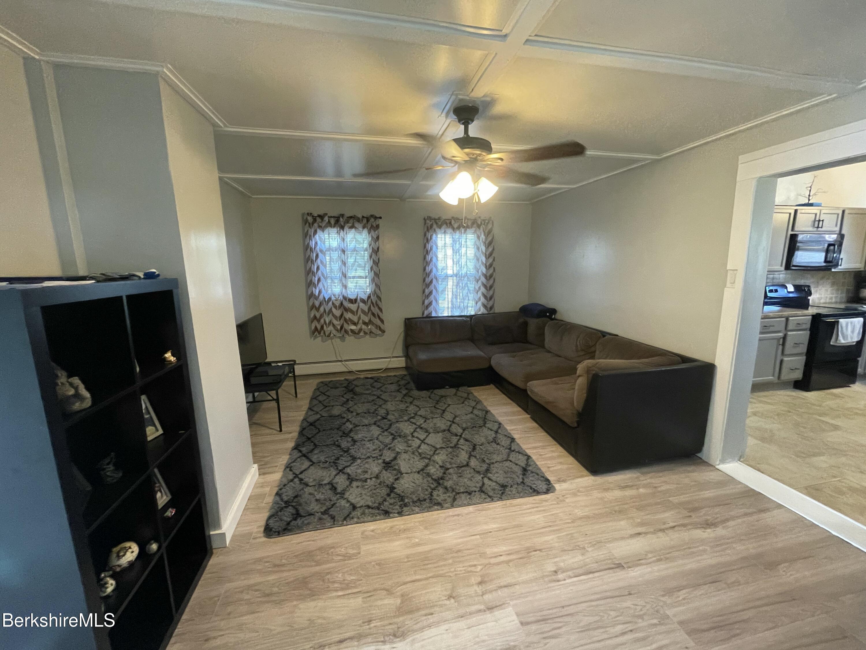 51 Foote Avenue Pittsfield, MA 01201 - Photo 10 of 16 a living room with furniture and a rug