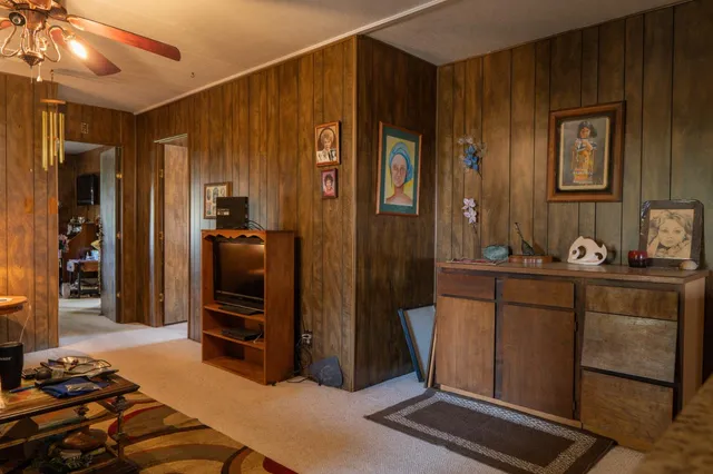 a bedroom with a bed and a mirror