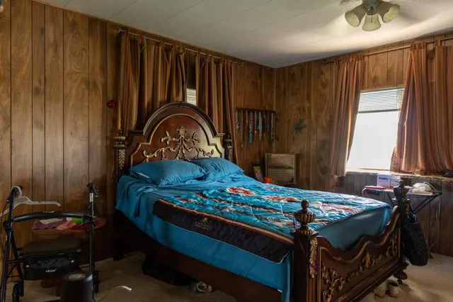 a bedroom with a bed and a dresser