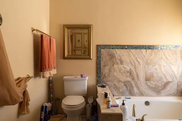 a bathroom with a toilet and a sink
