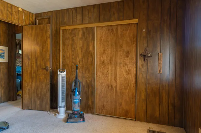 a view of a hallway with a door