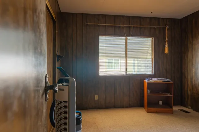 a room with a table and a window