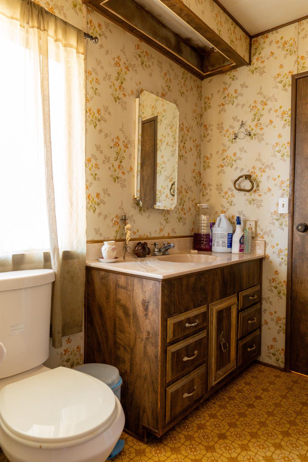 2500 North State Highway, Unit 36 Merced, CA 95348 - Photo 37 of 50 a bathroom with a sink a toilet and shower