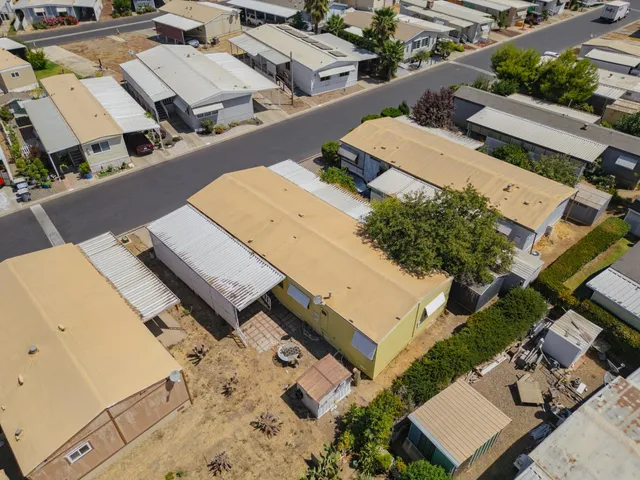 an aerial view of a house with swimming pool