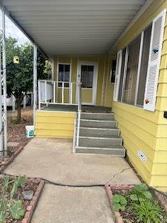 2500 North State Highway, Unit 36 Merced, CA 95348 - Photo 47 of 50 a view of the house with a porch