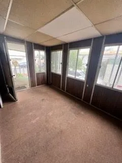 a view of an empty room with a fireplace