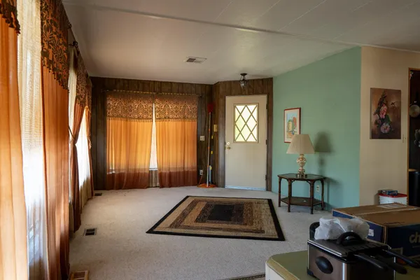 a living room with furniture and a window