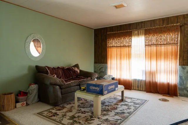 a living room with furniture and a window