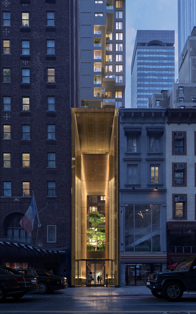 126 East 57th Street, Unit 2401 Manhattan, NY 10022 - Photo 8 of 26 a front view of a building with glass windows