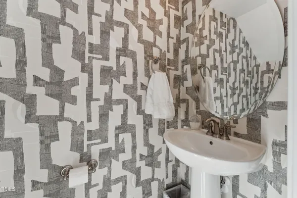 a bathroom with a sink and mirror