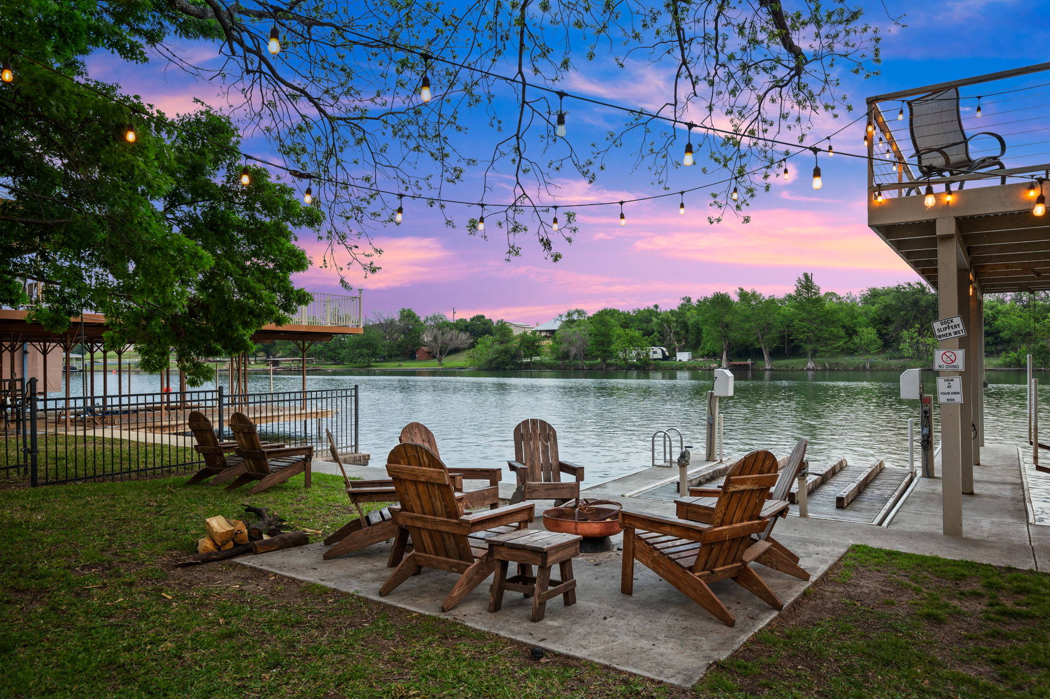a view of a lake with outdoor seating