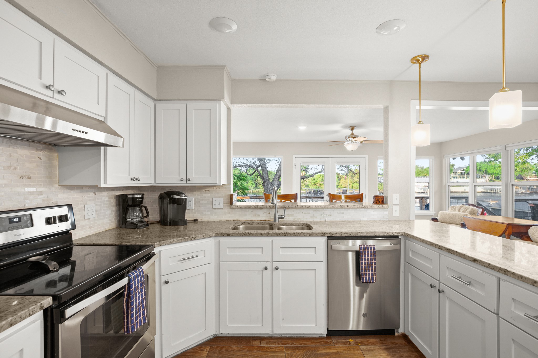 508 Riverside Drive Kingsland, TX 78639 - Photo 18 of 39 a kitchen with cabinets appliances a sink and a window
