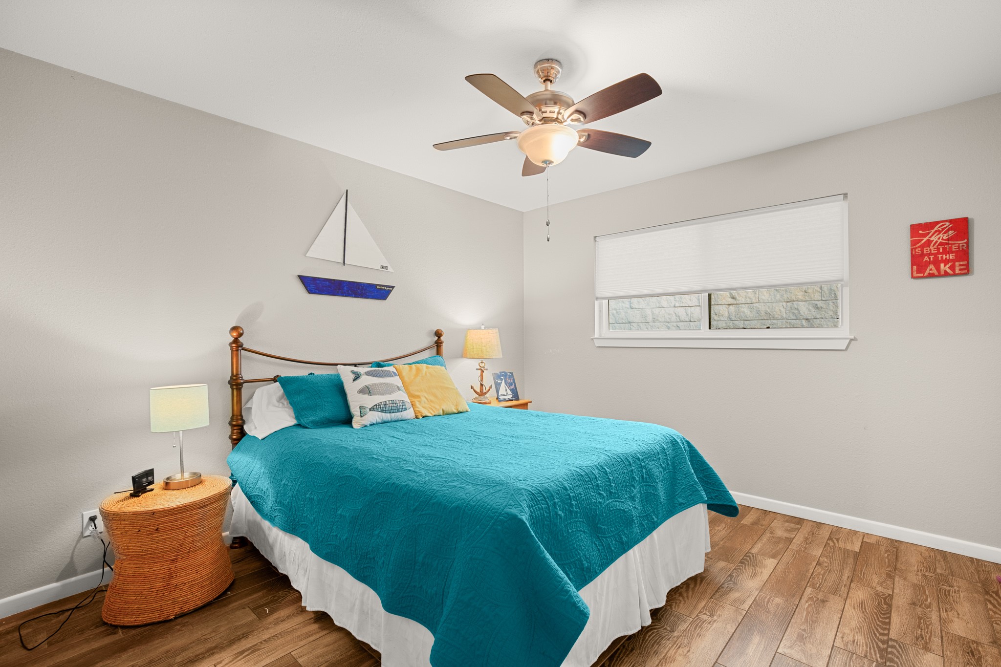 508 Riverside Drive Kingsland, TX 78639 - Photo 25 of 39 a bedroom with a bed and a chandelier