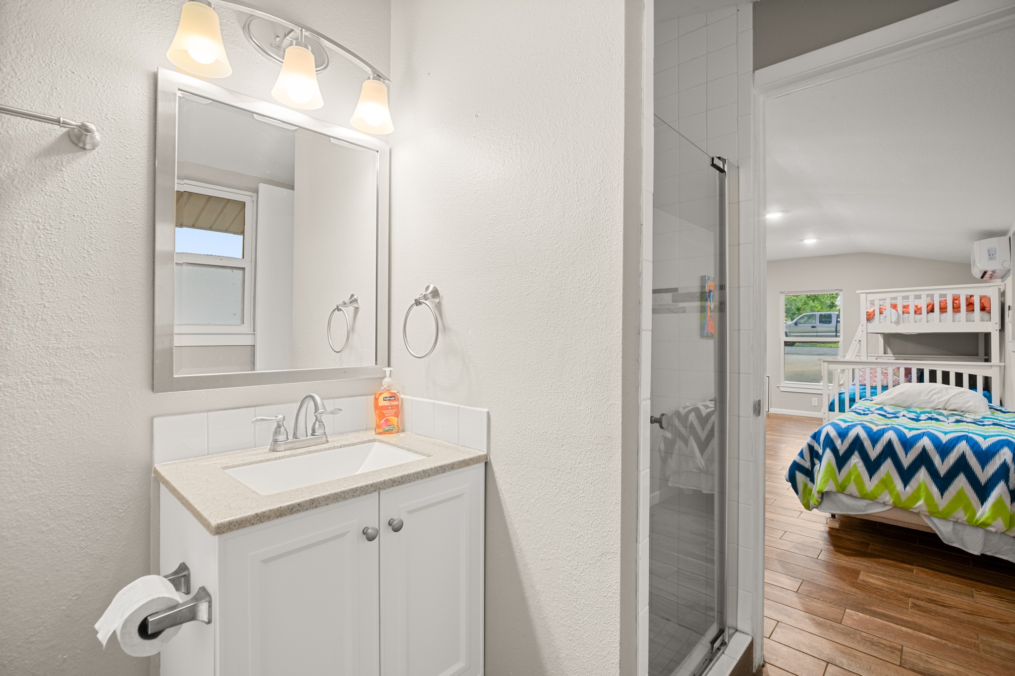 508 Riverside Drive Kingsland, TX 78639 - Photo 31 of 39 a bathroom with a sink mirror and vanity