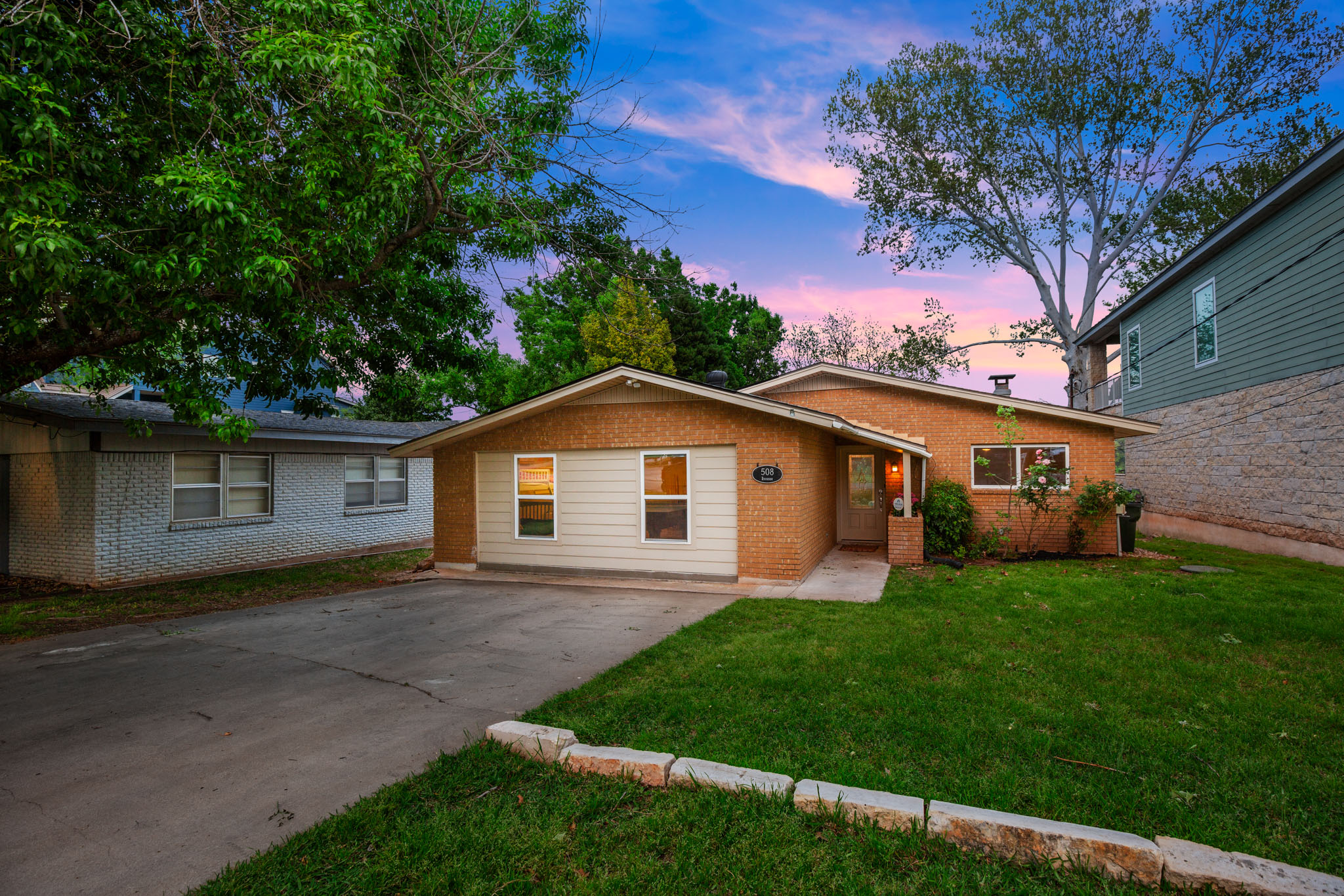 508 Riverside Drive Kingsland, TX 78639 - Photo 33 of 39 a front view of a house with a garden and yard