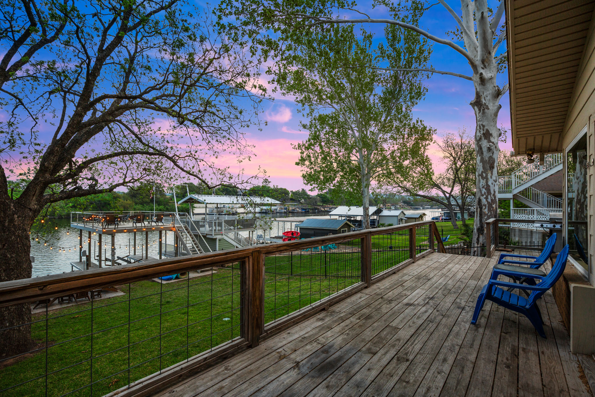 508 Riverside Drive Kingsland, TX 78639 - Photo 34 of 39 a balcony with wooden floor and outdoor seating