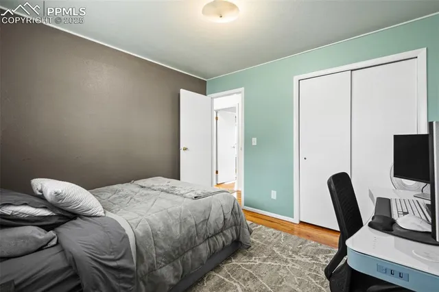 a bedroom with a bed and a chair