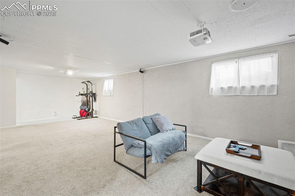 3716 Indianpipe Circle Colorado Springs, CO 80918 - Photo 19 of 33 a living room with furniture and a window