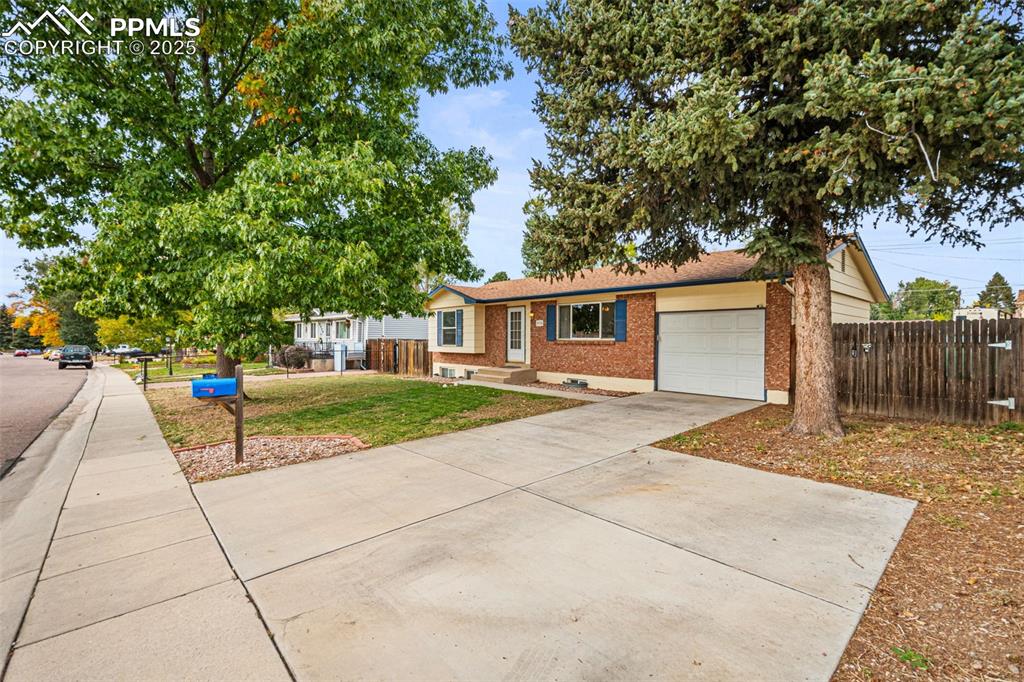 3716 Indianpipe Circle Colorado Springs, CO 80918 - Photo 2 of 33 a view of house with outdoor space and sitting area
