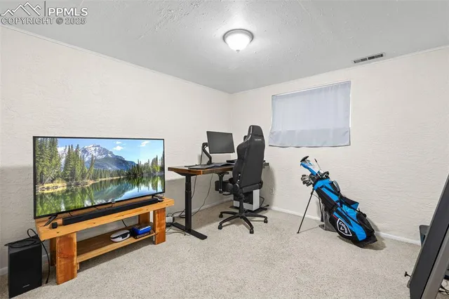 a room with gym equipment and windows