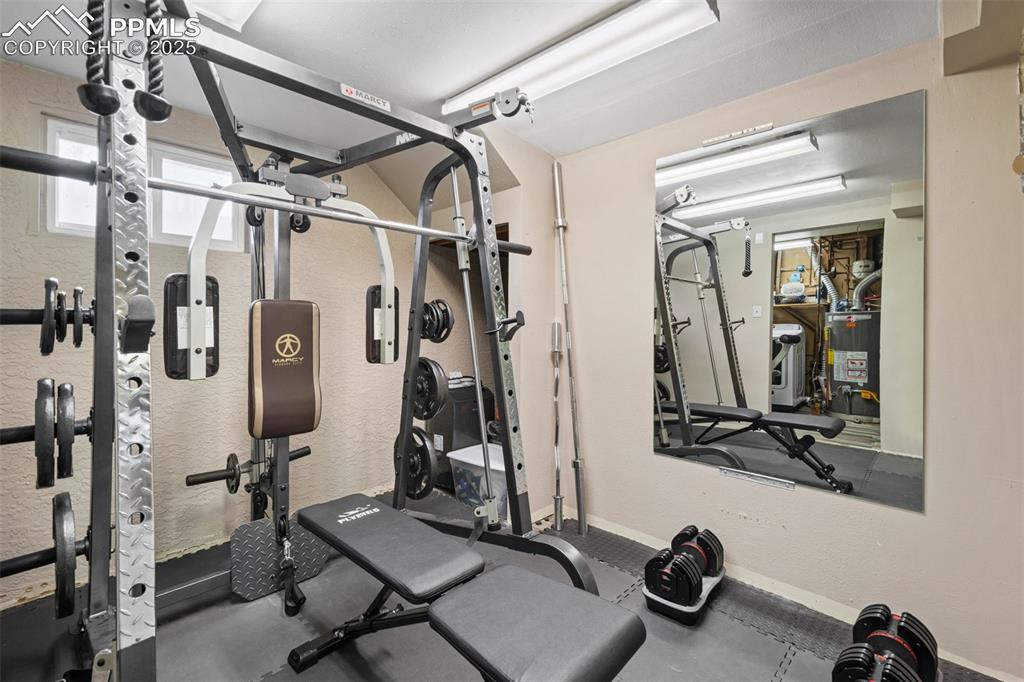 3716 Indianpipe Circle Colorado Springs, CO 80918 - Photo 26 of 33 a view of a room with gym equipment
