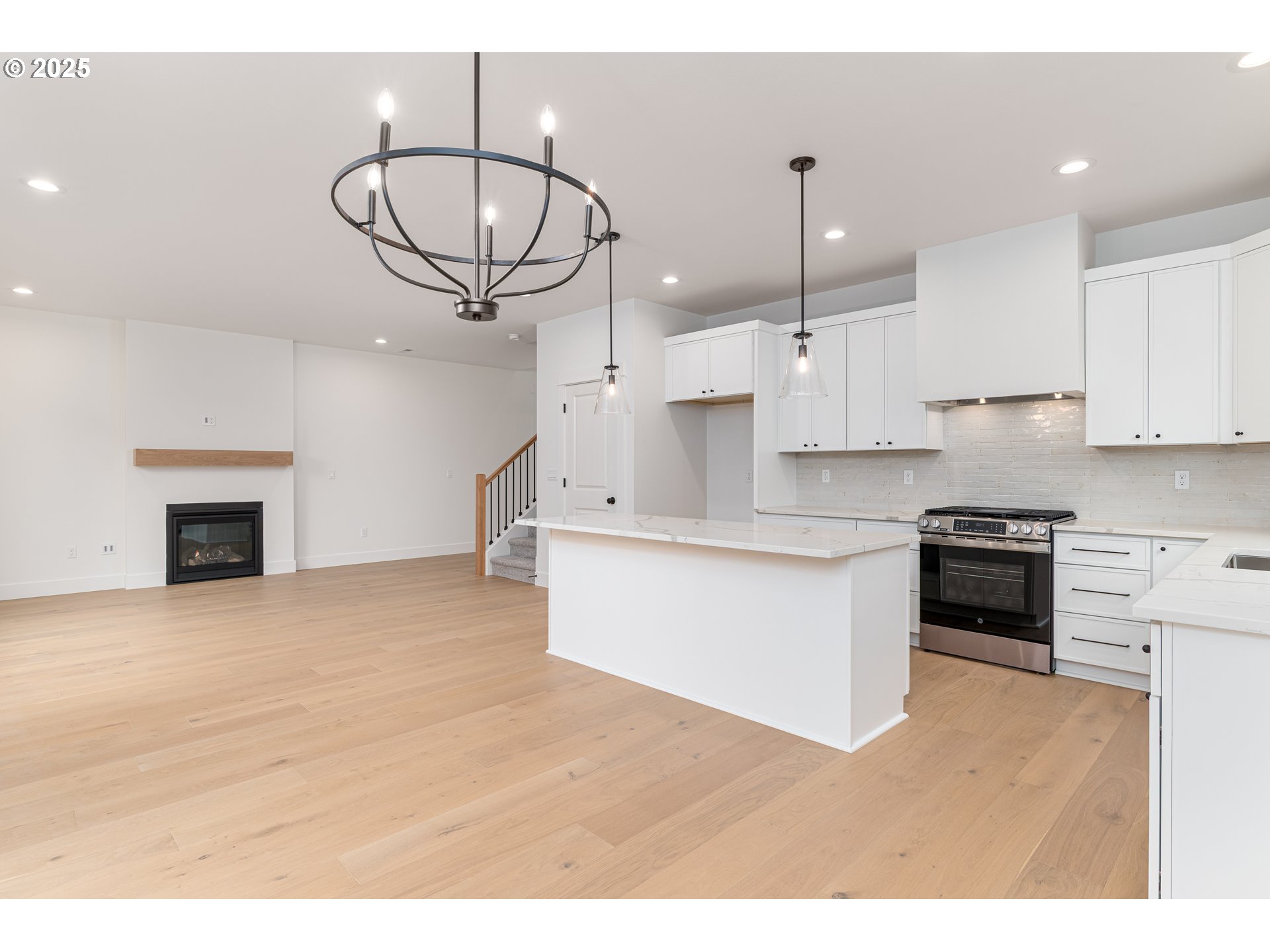 2263 Southwest Phyllis Place Gresham, OR 97080 - Photo 15 of 34 a kitchen with stainless steel appliances granite countertop a stove a refrigerator and a sink